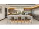 Modern kitchen featuring a large center island, stainless steel appliances, and barstool seating at 12 Desert Lake Ln, Henderson, NV 89011