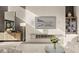 Bright living room with a modern fireplace, a large television, and stylish decor at 12 Desert Lake Ln, Henderson, NV 89011