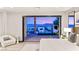 Serene primary bedroom with sliding glass doors leading to an outdoor pool and patio area at 12 Desert Lake Ln, Henderson, NV 89011