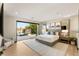 Bright main bedroom with scenic views, sliding glass doors to the outdoors, and modern décor at 12 Desert Lake Ln, Henderson, NV 89011