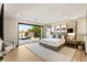 Beautifully staged bedroom with sliding glass doors and a view of the pool at 12 Desert Lake Ln, Henderson, NV 89011