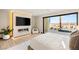 Well lit main bedroom with sliding glass doors and a built in fireplace at 12 Desert Lake Ln, Henderson, NV 89011
