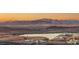 Stunning neighborhood view showcasing the lake and desert landscape with modern homes at 12 Desert Lake Ln, Henderson, NV 89011