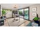 Bright office with modern decor, a large window, and a sliding glass door to a courtyard at 12 Desert Lake Ln, Henderson, NV 89011
