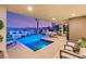 Luxury pool features a spa, ample outdoor space, desert views, and a spiral staircase at 12 Desert Lake Ln, Henderson, NV 89011