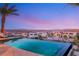 The tranquil pool with mountain views features zero edge, perfect for outdoor entertaining and relaxation at 12 Desert Lake Ln, Henderson, NV 89011