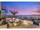 Relaxing rooftop deck with cozy seating enjoys panoramic views of desert landscape and mountain vistas at 12 Desert Lake Ln, Henderson, NV 89011