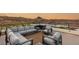 This rooftop deck offers comfortable lounge seating, modern chairs, and gorgeous views at 12 Desert Lake Ln, Henderson, NV 89011