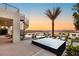 Relaxing rooftop patio features a seating area, lush vegetation, and a spiral staircase at 12 Desert Lake Ln, Henderson, NV 89011