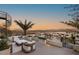 Enjoy mountain views from this stylish rooftop patio with a spiral staircase and modern seating at 12 Desert Lake Ln, Henderson, NV 89011