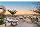 This luxurious rooftop patio features a relaxing seating area with mountain and city views at 12 Desert Lake Ln, Henderson, NV 89011