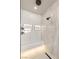 Elegant shower featuring a built-in bench, overhead lighting, and modern showerhead at 12 Desert Lake Ln, Henderson, NV 89011