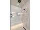 Detail shot of a walk-in shower with marble tiling, dual shower heads, and built-in seating at 12 Desert Lake Ln, Henderson, NV 89011