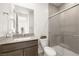 Stylish bathroom featuring modern fixtures, a vanity with a sink, and a tiled shower at 12039 Rockview Point St, Las Vegas, NV 89138