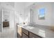 Modern bathroom vanity featuring sleek countertops, wood cabinets, and contemporary hardware at 12039 Rockview Point St, Las Vegas, NV 89138