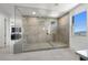 Bathroom showcasing a large walk-in shower with tile surround, seating and modern fixtures at 12039 Rockview Point St, Las Vegas, NV 89138