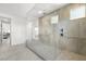 Bathroom showcasing a large walk-in shower with tile surround, seating and modern fixtures at 12039 Rockview Point St, Las Vegas, NV 89138