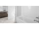 Clean bathroom showcasing a bathtub with tile surround and modern finishes at 12039 Rockview Point St, Las Vegas, NV 89138