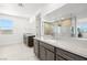Bright bathroom with dual vanities, modern finishes, and tile flooring at 12039 Rockview Point St, Las Vegas, NV 89138