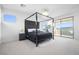 Bright bedroom with a stylish bed, a sliding glass door to a balcony and comfortable furnishings at 12039 Rockview Point St, Las Vegas, NV 89138