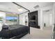 Modern bedroom features a canopy bed, fireplace, mounted TV, and bright windows with beautiful views at 12039 Rockview Point St, Las Vegas, NV 89138