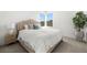 Cozy bedroom with neutral decor, comfortable bed, and natural light at 12039 Rockview Point St, Las Vegas, NV 89138