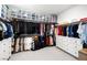 Well-organized walk-in closet with ample storage, hanging racks, and built-in drawers at 12039 Rockview Point St, Las Vegas, NV 89138