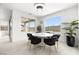 Bright dining room featuring stylish lighting, modern black chairs and a round marble table perfect for Gathering meals at 12039 Rockview Point St, Las Vegas, NV 89138