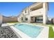 A view of the backyard pool and patio area, which includes modern landscaping and outdoor living space at 12039 Rockview Point St, Las Vegas, NV 89138