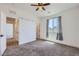 A well-lit bedroom with a large window and neutral decor at 1213 Granite Falls Pl, North Las Vegas, NV 89084