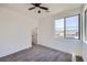 A well-lit bedroom with a large window overlooking city views at 1213 Granite Falls Pl, North Las Vegas, NV 89084