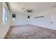 The well-lit bedroom has two windows, neutral walls, and a ceiling fan at 1213 Granite Falls Pl, North Las Vegas, NV 89084
