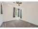 Comfortable bedroom features a ceiling fan, neutral carpet, and ample natural light from well-placed windows at 1213 Granite Falls Pl, North Las Vegas, NV 89084