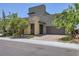 Contemporary two-story house with a two-car garage and desert landscaping in a sunny neighborhood at 1213 Granite Falls Pl, North Las Vegas, NV 89084