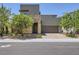 Modern two-story home featuring a stone accent wall and a two-car garage with a landscaped front yard at 1213 Granite Falls Pl, North Las Vegas, NV 89084
