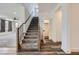 The hallway features hardwood floors and a staircase leading to the upper level at 1213 Granite Falls Pl, North Las Vegas, NV 89084
