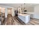 Modern kitchen featuring a large island, stainless steel appliances, and sleek gray cabinetry at 1213 Granite Falls Pl, North Las Vegas, NV 89084