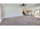 A spacious living room leads into a modern kitchen with stainless steel appliances at 1213 Granite Falls Pl, North Las Vegas, NV 89084