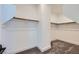 A walk-in closet with ample shelving and carpeted flooring at 1213 Granite Falls Pl, North Las Vegas, NV 89084