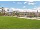 Community green space with walking paths, seating, and manicured landscaping at 12282 Azure Gate Rd # 4, Las Vegas, NV 89183