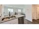 Well-equipped kitchen featuring granite countertops and stainless steel appliances, flowing into the living area at 12282 Azure Gate Rd # 4, Las Vegas, NV 89183