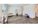 Open concept living room with wood-look floors, offering a versatile space for relaxing and entertaining at 12282 Azure Gate Rd # 4, Las Vegas, NV 89183
