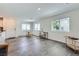 Well-lit living room with multiple windows, adjacent to the kitchen area for an open, airy feel at 12282 Azure Gate Rd # 4, Las Vegas, NV 89183