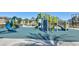 Bright and colorful community playground with slides, climbing structures, and swings at 12282 Azure Gate Rd # 4, Las Vegas, NV 89183