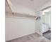 Bright walk-in closet featuring closet system and access to ensuite bathroom with stylish sliding door at 12282 Azure Gate Rd # 4, Las Vegas, NV 89183