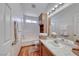 Well-lit bathroom with a vanity, a large mirror, and coordinated towel sets at 1290 Dalene Ave, Henderson, NV 89002
