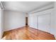 Bright bedroom featuring gleaming hardwood floors and a spacious closet at 1290 Dalene Ave, Henderson, NV 89002