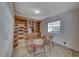 Bright bonus room features built-in shelves, a large window, accent rug and two chairs at 1290 Dalene Ave, Henderson, NV 89002