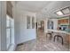 Bright dining area featuring tile floors, a window and view of the kitchen with stainless appliances at 1290 Dalene Ave, Henderson, NV 89002