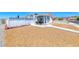 Charming home featuring gravel landscaping and a cozy front porch seating area at 1290 Dalene Ave, Henderson, NV 89002